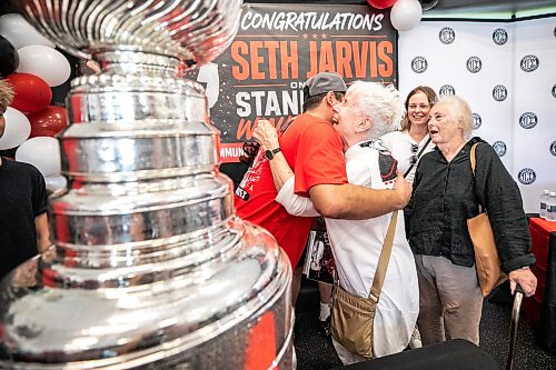 MIKAELA MACKENZIE / FREE PRESS
	
Seth Jarvis hugs his grandmother, Ruth Shields, and the Stanley Cup at the Tuxedo Community Centre on Monday, Aug. 10, 2026.

For Grace Penner story.
Free Press 2026