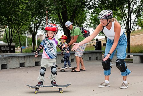 ROBERT LEE / FREE PRESS
Koa Case (left), 3, skates without the assistance from his mother, Sandra at the skate park at The Forks in Winnipeg on Tuesday, August 11, 2026.