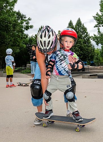 ROBERT LEE / FREE PRESS
Koa Case, 3, balances with the assistance of his mother, Sandra at the skate park at The Forks in Winnipeg on Tuesday, August 11, 2026. 