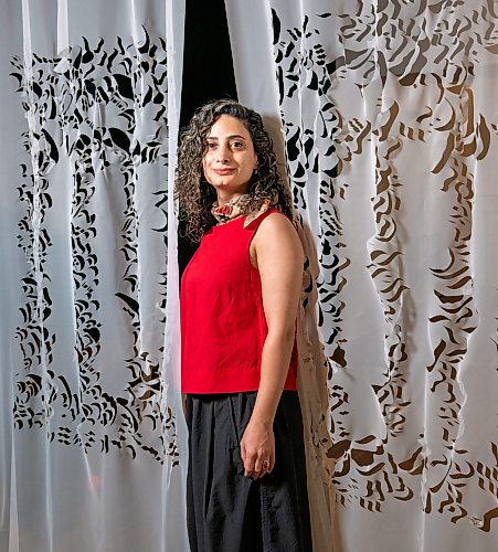 ROBERT LEE / FREE PRESS
Winnipeg visual artist Hamideh Behgar poses at her new solo exhibition at Aceartinc., drawing on the visual and architectural traditions of Persian miniature painting and the snowy landscapes of Manitoba in collage, sculpture and installation on Tuesday, August 11, 2026. Behgar holds an MFA from the University of Manitoba and a Bachelor of Graphic Design from the University of Applied Science & Technology in Iran.