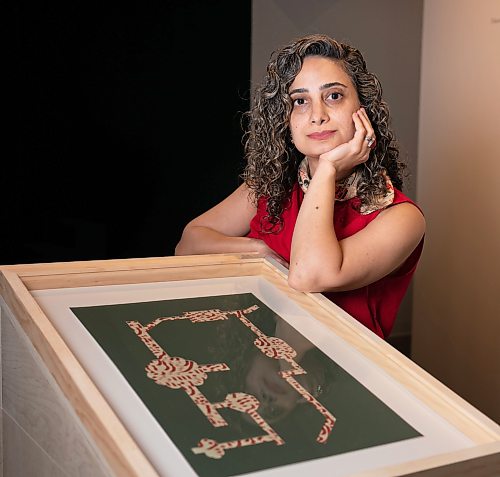 ROBERT LEE / FREE PRESS
Winnipeg visual artist Hamideh Behgar poses at her new solo exhibition at Aceartinc., drawing on the visual and architectural traditions of Persian miniature painting and the snowy landscapes of Manitoba in collage, sculpture and installation on Tuesday, August 11, 2026.  Behgar holds an MFA from the University of Manitoba and a Bachelor of Graphic Design from the University of Applied Science &amp; Technology in Iran.