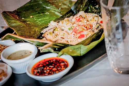 JOHN WOODS / FREE PRESS
Mama's chicken in banana leaf at House of Ma, a new Asian-fusion restaurant on Bannatyne Tuesday, August 11, 2026. True Hospitality has opened a couple of new ventures on Bannatyne.
reporter: eva