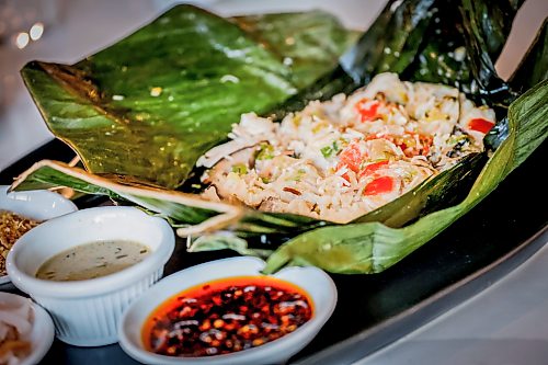 JOHN WOODS / FREE PRESS
Mama's chicken in banana leaf at House of Ma, a new Asian-fusion restaurant on Bannatyne Tuesday, August 11, 2026. True Hospitality has opened a couple of new ventures on Bannatyne.
reporter: eva