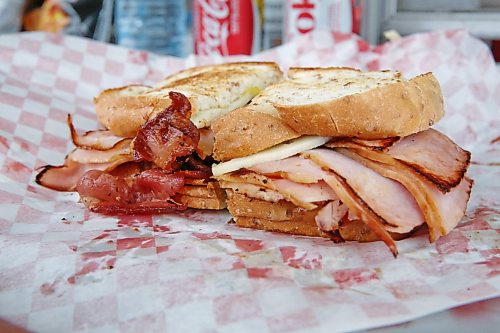The Cubano sandwich at Sullivan’s Delights food truck is a hefty one: meaty layers of ham, bacon, pickles and Swiss cheese sandwiched between two slices of rye bread, slathered with your choice of mild or hot mustard. (Matt Goerzen/The Brandon Sun)