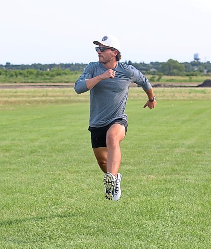 Bryce Keilback demonstrates a warmup drill. (Rowan McCarthy/Brandon Sun)