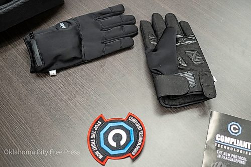 The G.L.O.V.E., developed by Compliant Technologies LLC, sits on a table after a demonstration at the Oklahoma County Detention Center in Oklahoma City, March 22, 2023. (Brett Dickerson/Oklahoma City Free Press via AP)