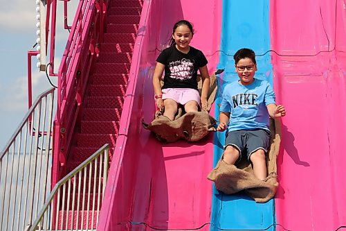 12082026
Braylee and Skyler (no last names given) ride the giant slide during Midway Madness in the Canadian Tire parking lot in Brandon’s south end on Wednesday afternoon. The four day fair began on Monday and ends today. (Tim Smith/The Brandon Sun)