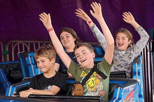 12082026
(Front L-R followed by back L-R) Owen Berry, Noah Hammond, Angelique Berry and Sophia Berry ride the Himalaya ride during Midway Madness in the Canadian Tire parking lot in Brandon’s south end on Wednesday afternoon. The four day fair began on Monday and ends today. (Tim Smith/The Brandon Sun)