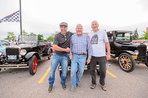Mike Sudoma/Free Press
(Left to Right) Friends and Car enthusiasts Josh Jasysyn Kendall Bingeman and Allen Peter share a moment in from of their vintage Fords Sunday evening
August 9, 2026
