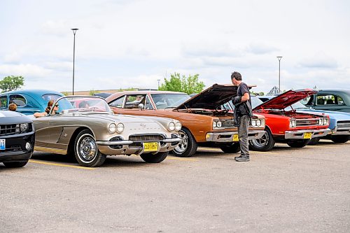 Mike Sudoma/Free Press
An attendee checks out a 1969 Dodge Super Bee parked amongst other vintage American muscle cars during the Winnipeg Cruising Culture car show at Finns Grant Park Sunday night
August 9, 2026