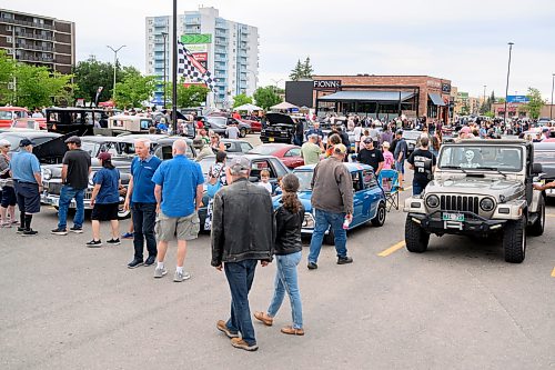 Mike Sudoma/Free Press
Attendees walk down aisles of cars and motorcycles at the Winnipeg Cruise Culture Sunday night
August 9, 2026
