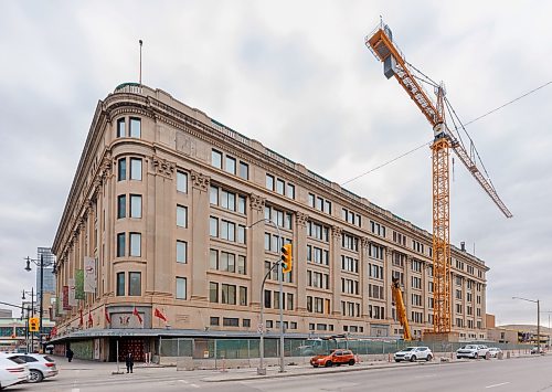 MIKE DEAL / FREE PRESS
The former Bay building at 450 Portage Ave, now called, Wehwehneh Bahgahkinahgohn — "It is visible" in Anishinaabemowin, continues to be under construction, with a crane taking up north-bound lanes of Memorial Blvd.
250319 - Wednesday, March 19, 2025.