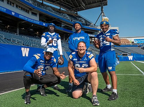 ROBERT LEE / FREE PRESS
(From back left) defensive end Nuer Gatkuoth, defensive end De'Shaan Dixon, defensive end Kydran Jenkins, linebacker Tony Jones and wide receiver Kevens Clercius pose for a photo during the Winnipeg Blue Bomers’ walkthrough at Princess Auto Stadium in Winnipeg on Thursday, August 13, 2026.