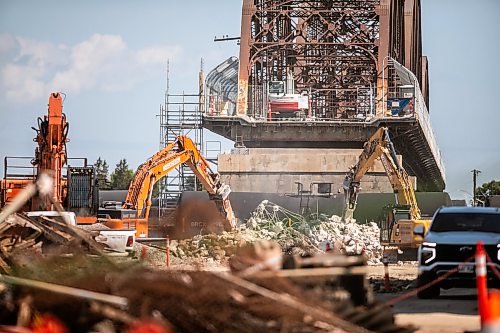 MIKAELA MACKENZIE / FREE PRESS
	
Demolition at the Arlington Street Bridge on Thursday, Aug. 13, 2026.

For Melissa story.
Free Press 2026