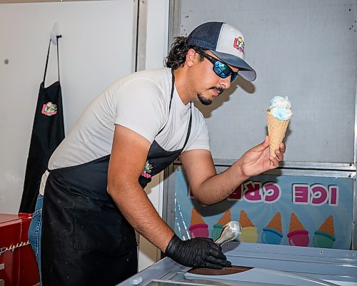 ROBERT LEE / FREE PRESS
Paul Abdul-Raymond, owner of the Classic Scoop, is photographed in his ice cream trailer that appears at public events and private functions in Winnipeg on Thursday, August 13, 2026.