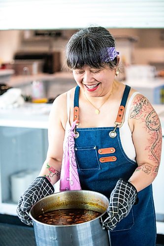 MIKAELA MACKENZIE / FREE PRESS
StrEAT Feast vendor Marilyn Magtoto with the sinigang for her sinigang birria tacos on Thursday, Aug. 13, 2026.
For Tiago story.
Free Press 2026