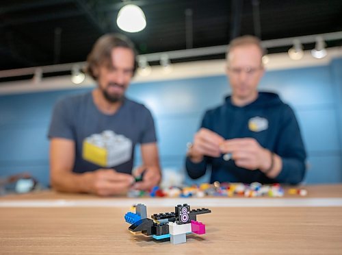 ROBERT LEE / FREE PRESS
Ian Makita, left, and Jason Poturica, co-owners of The Little Brick Market examine some lego pieces  at their new store on Grant Ave. in Winnipeg on Thursday, August 13, 2026. The new and used Lego shop, is tripling its size after being open for roughly a year.