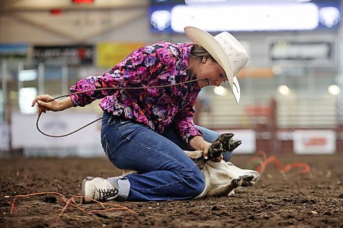 13082026
Billie Cowan of Gainsborough, Saskatchewan ties a goats legs while competing in the goat tying event during the high school rodeo on the opening day of the 2026 Virden Indoor Rodeo and Wild West Daze on Thursday. The annual Rodeo and Wild West Daze runs until Sunday with a variety of events including a parade, a demolition derby, nightly rodeo performances and other events. (Tim Smith/The Brandon Sun)