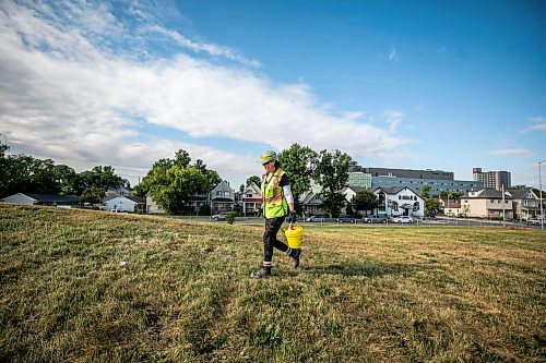 MIKAELA MACKENZIE / FREE PRESS
City crew member Tee Silver checks for needles and other hazardous materials at Freight House park on Thursday, Aug. 13, 2026.
For Malak story.
Free Press 2026