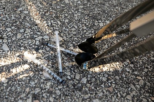 MIKAELA MACKENZIE / FREE PRESS
A city crew cleans up needles and other hazardous materials at Freight House park on Thursday, Aug. 13, 2026.
For Malak story.
Free Press 2026
