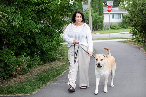 MIKAELA MACKENZIE / FREE PRESS
	
Tara Miller and her dog, Corbi, on Thursday, Aug. 13, 2026. Miller has had to make some difficult decisions regarding Corbi’s vet care, and animal shelters say rising vet bills are forcing more people to surrender their pets. 

For Tiago story.
Free Press 2026