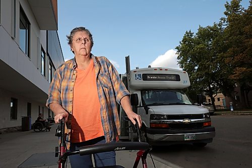 12082026
Caroline Fischer stands outside the Brandon Access Transit bus after being dropped off at the Brandon Regional Health Centre for dialysis treatment on Wednesday. Fischer is concerned that the bus often drops patients off at a distance from the hospital entrance which makes it challenging for individuals with mobility problems. (Tim Smith/The Brandon Sun)
***please cross-reference with Rylee story for accuracy