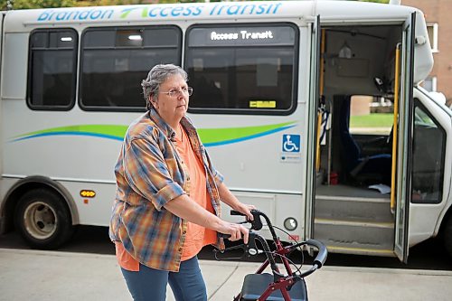 12082026
Caroline Fischer stands outside the Brandon Access Transit bus after being dropped off at the Brandon Regional Health Centre for dialysis treatment on Wednesday. Fischer is concerned that the bus often drops patients off at a distance from the hospital entrance which makes it challenging for individuals with mobility problems. (Tim Smith/The Brandon Sun)
***please cross-reference with Rylee story for accuracy