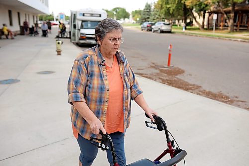12082026
Caroline Fischer walks from the Brandon Access Transit bus after being dropped off at the Brandon Regional Health Centre for dialysis treatment on Wednesday. Fischer is concerned that the bus often drops patients off at a distance from the hospital entrance which makes it challenging for individuals with mobility problems. (Tim Smith/The Brandon Sun)
***please cross-reference with Rylee story for accuracy