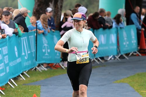 Shannon Sabourin of Ste. Anne (353) smiles at onlookers as she completes her Sprint race during the Riding Mountain Triathlon on Saturday. (Perry Bergson/The Brandon Sun)
Aug. 15, 2026
