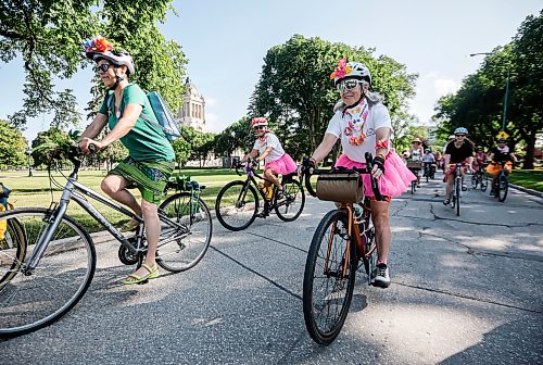 JOHN WOODS / FREE PRESS
Rose MacDonald, centre left, and Sarah Gravelle-MacKenzie, centre right, and other women participate in the Fancy Women Bike Ride at the Legislature grounds Sunday, August 16, 2026. 

reporter: maggie
