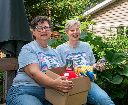 ROBERT LEE / FREE PRESS
Kalyn Falk, right, and project partner Lindsay Unger pose for a photo in Winnipeg on Monday, August 17, 2026. The pair help lead the TDOR Care Package Project, launched in 2020 to honour Trans Day of Remembrance by preparing about 50 care packages so trans and non-binary community members feel valued, seen and cared for. This year, the project is partnering with Resource Assistance for Youth, which will accept donations and issue charitable tax receipts ahead of the Nov. 20 day of remembrance.