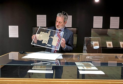 Ruth Bonneville / Free Press
LOCAL - ancient papyrus
Photo of Dr. C. Michael Sampson, Professor of Classics and a papyrologist,, with a transactional document almost 2000 years old, on view at the exhibit inside the Elizabeth Dafoe Library at the University of Manitoba, Monday.
"The Ancient Inbox," the University of Manitoba's rare public exhibit of ancient papyrus documents, opens today. Some of these pieces are up to 2,000 years old, on loan from the University of Michigan Papyrology Collection, and it's the first public display of genuine papyri in Winnipeg.
The exhibit runs through September 30 in Archives & Special Collections, 3rd floor of the Elizabeth Dafoe Library
See story by Zoe
Aug 17th,, 2026