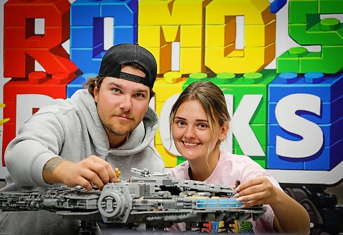 JOHN WOODS / FREE PRESS
Madison Froome and Ashton Romaniuk are photographed with a Lego 75192 Millennium Falcon in their new Lego store Romo’s Bricks Tuesday, July 21, 2026. 

reporter: aaron