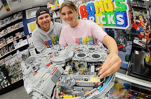 JOHN WOODS / FREE PRESS
Madison Froome and Ashton Romaniuk are photographed with a Lego 75192 Millennium Falcon in their new Lego store Romo’s Bricks Tuesday, July 21, 2026.
reporter: aaron