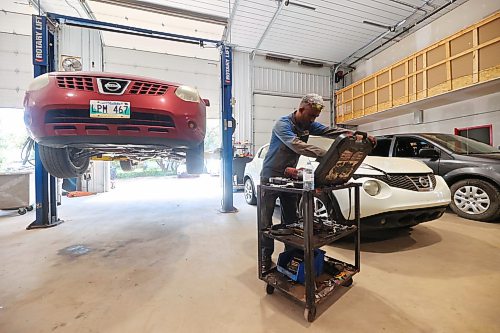 ABC Auto Service and Salvage mechanic Maeble Fisheye readies a power ratchet to remove tires on a vehicle parked in one of the work bays at the company’s 17th Street East location on Tuesday. (Matt Goerzen/The Brandon Sun)