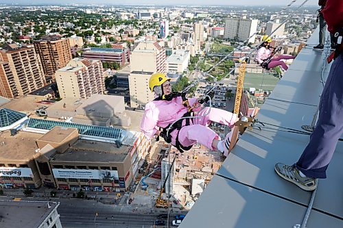 Ruth Bonneville / Free Press

LOCAL - Easter Seal Drop Zone 

Grandmother, Christine Jameus sets her feet off the ledge of the Manitoba Hydro Building with her granddaughter, Morgan Parker to her left to raise funds for Easters Seals Tuesday morning.  The all-dressed in pink duo were just 2 of the about 45 people that took part in the charity event.  

The annual event sees participants rappel from the top of the buildings to raise funds for Manitoba Possible.

See story by Zoe

Aug 18th,,  2026