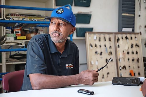 ABC Auto Service and Salvage owner Sam Mulaw briefly looks out a window during an interview with Brandon Sun business reporter Abiola Odutola on Tuesday afternoon. (Matt Goerzen/The Brandon Sun)