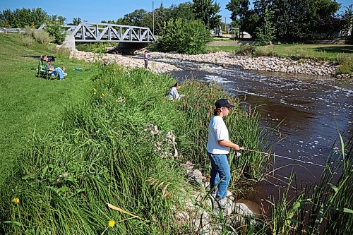 18082026
Members of the Guimond and Helbig families fish from the bank of Plum Creek in Souris, Manitoba while visiting the westman community from Winnipeg and Headingley on Tuesday.
(Tim Smith/The Brandon Sun)
