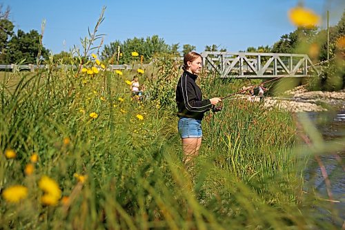 18082026
Teagan Helbig fishes from the bank of Plum Creek in Souris, Manitoba on Tuesday while visiting the westman community with family and friends.
(Tim Smith/The Brandon Sun)