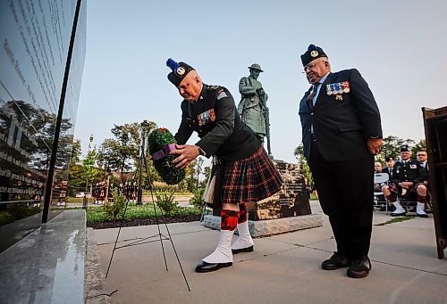 JOHN WOODS / FREE PRESS
Lieutenant colonel Mark Singleton, left, lays a wreath with chief warrant officer Steve MacMillan (ret) as members of the Queen's Own Cameron Highlanders and people participate in a Dieppe Raid sunset commemoration ceremony at Vimy Ridge Park Tuesday, August 18, 2026. The ceremony remembered the regiment’s involvement in the Dieppe Raid.

reporter: standup