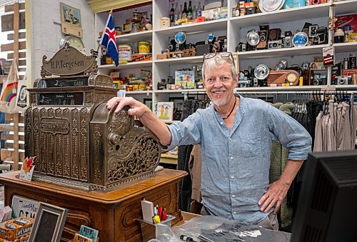 ROBERT LEE / FREE PRESS
Stefan Tergesen, owner of H.G. Tergesen &amp; Sons, poses with the “new cash register” which is from 1910, inside his store on Tuesday, August 18, 2026. The store has stood in the same spot since January 1, 1899.