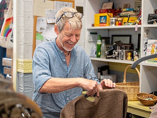 ROBERT LEE / FREE PRESS
Stefan Tergesen, owner of H.G. Tergesen &amp; Sons, a long-running store in Gimli, prepares merchandise for display on Tuesday, August 18, 2026. The store has stood in the same spot since January 1, 1899.