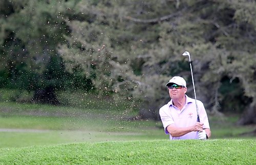 Jack McDiarmid splashes a bunker shot inside tap-in range on the 16th hole. (Thomas Friesen/The Brandon Sun)