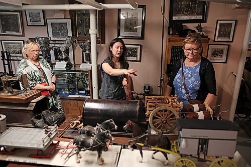 Kaelyn Delaurier, a summer intern at the Daly House Museum and Archives, leads a tour during the museum’s tea and tour event on Wednesday. (Tim Smith/The Brandon Sun)
