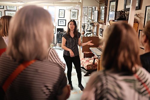 19082026
Kaelyn Delaurier, a summer intern at the Daly House Museum and Archives, leads a tour during the museum’s tea &amp; tour event on Wednesday. 
(Tim Smith/The Brandon Sun)