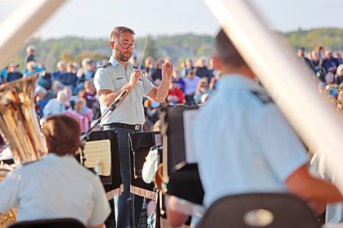The conductor of the Royal Canadian Air Force Band leads on stage at Riverbank Discovery Centre during a free show in this image from 2024. The RCAFB will return to Brandon and the Riverbank Discovery Centre on Sept. 10 at 7 p.m. (Brandon Sun files)