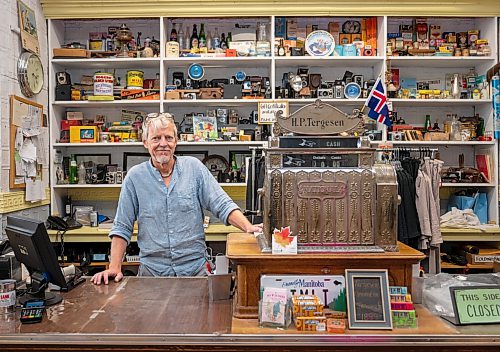 ROBERT LEE / FREE PRESS
Stefan Tergesen, owner of H.G. Tergesen & Sons, poses with the “new cash register” which is from 1910, inside his store on Tuesday, August 18, 2026. The store has stood in the same spot since January 1, 1899.