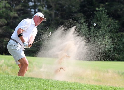 Kurt Martin hits a bunker shot during the Tamarack golf tournament men's quarterfinals at Clear Lake Golf Course on Thursday. (Thomas Friesen/The Brandon Sun)
