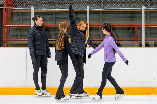 MIKE DEAL / FREE PRESS
Dana (centre) and Marrin McKee (left), mother-daughter figure skating coach’s during a training session with young figure skaters, Kaylee Kirkpatrick (purple top), 13, and Makayla Heshka, 12, Thursday morning at Dakota Community Centre.
Marrin has been skating all of her life, growing up with her mother as her coach and continuing to compete nationally into her adult years.
Reporter: Grace Penner
260820 - Thursday, August 20, 2026.
