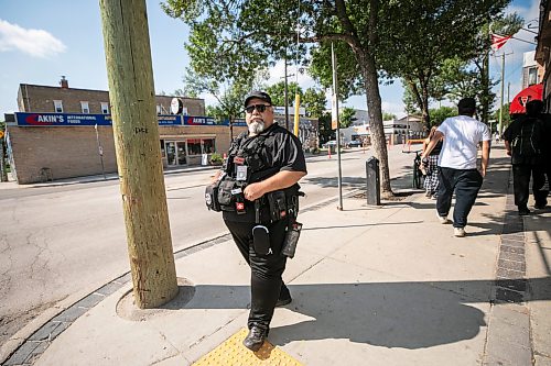 MIKAELA MACKENZIE / FREE PRESS
	
Michael Paille, executive director of the Sargent Business Community, on patrol on Sargent Avenue on Friday, Aug. 21, 2026.

For Ѡstory.
Free Press 2026